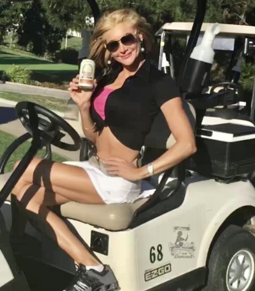 a woman showing a bottle and smiling