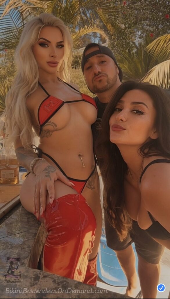 two women and a man posing for a picture