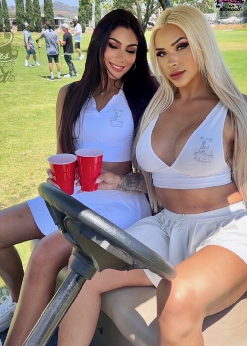 two women in a Golf cart